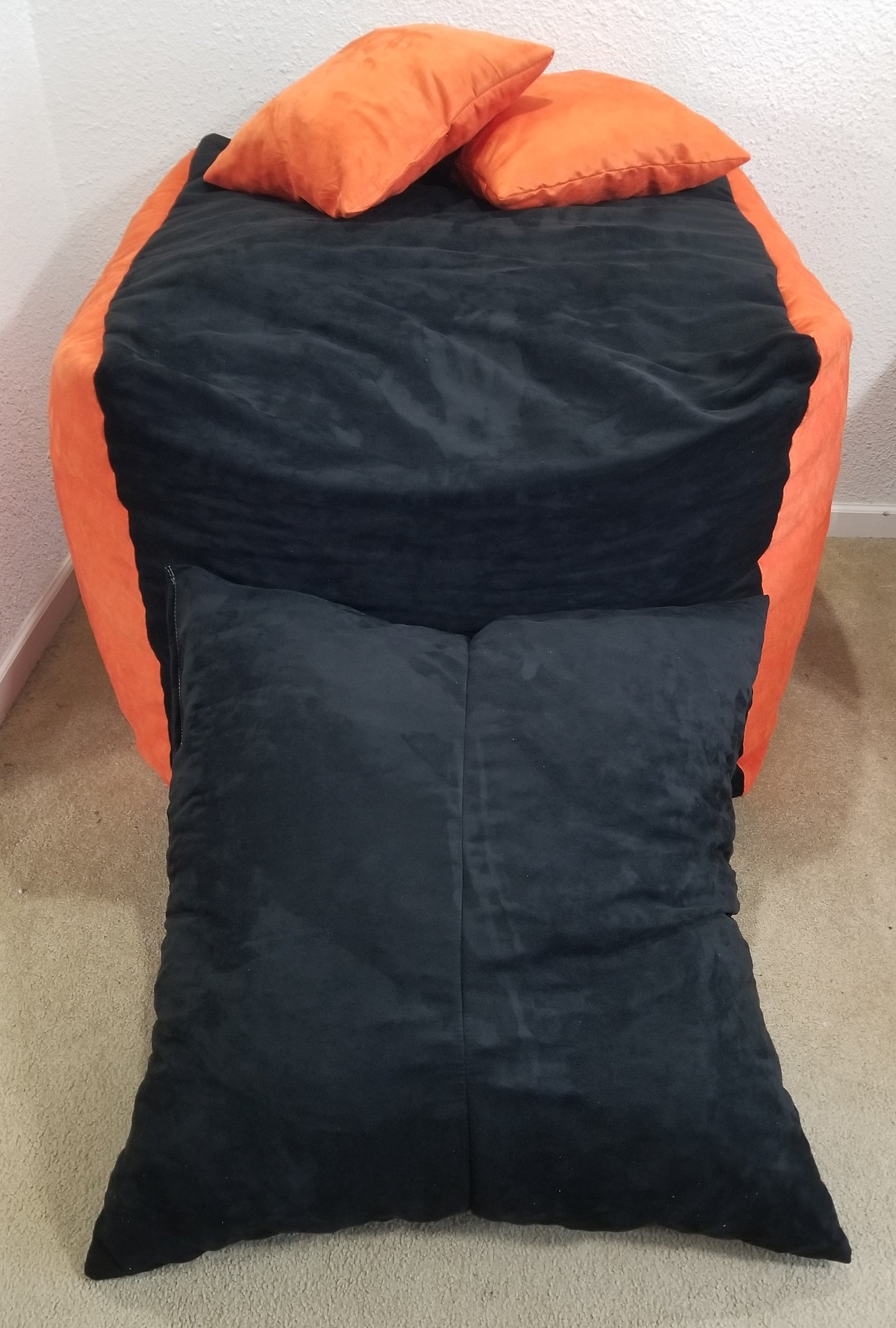 A Nesting Chair Set In Orange And Black Microfiber