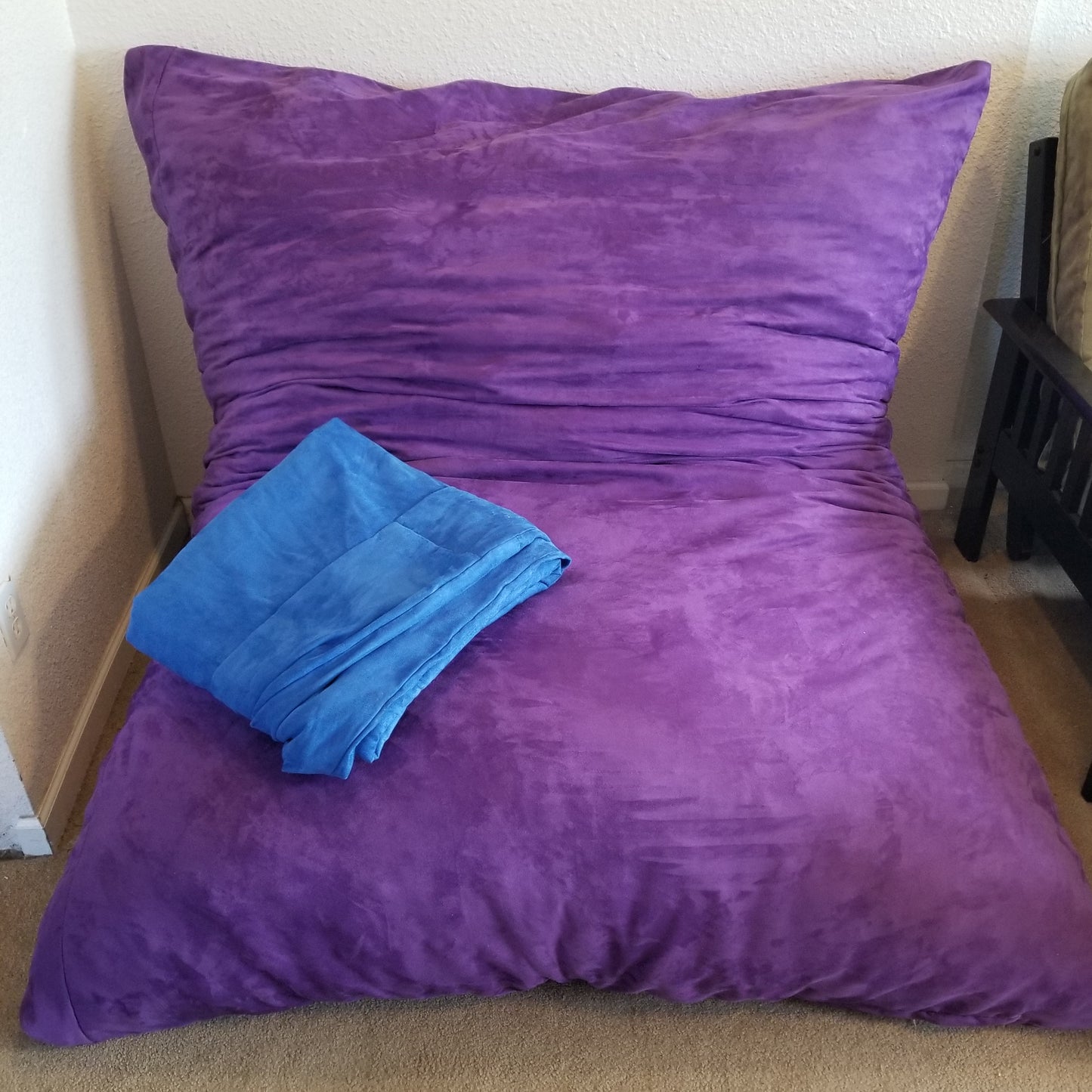 A Full Hug Bed & Crash Pad Shown With Cover Removed