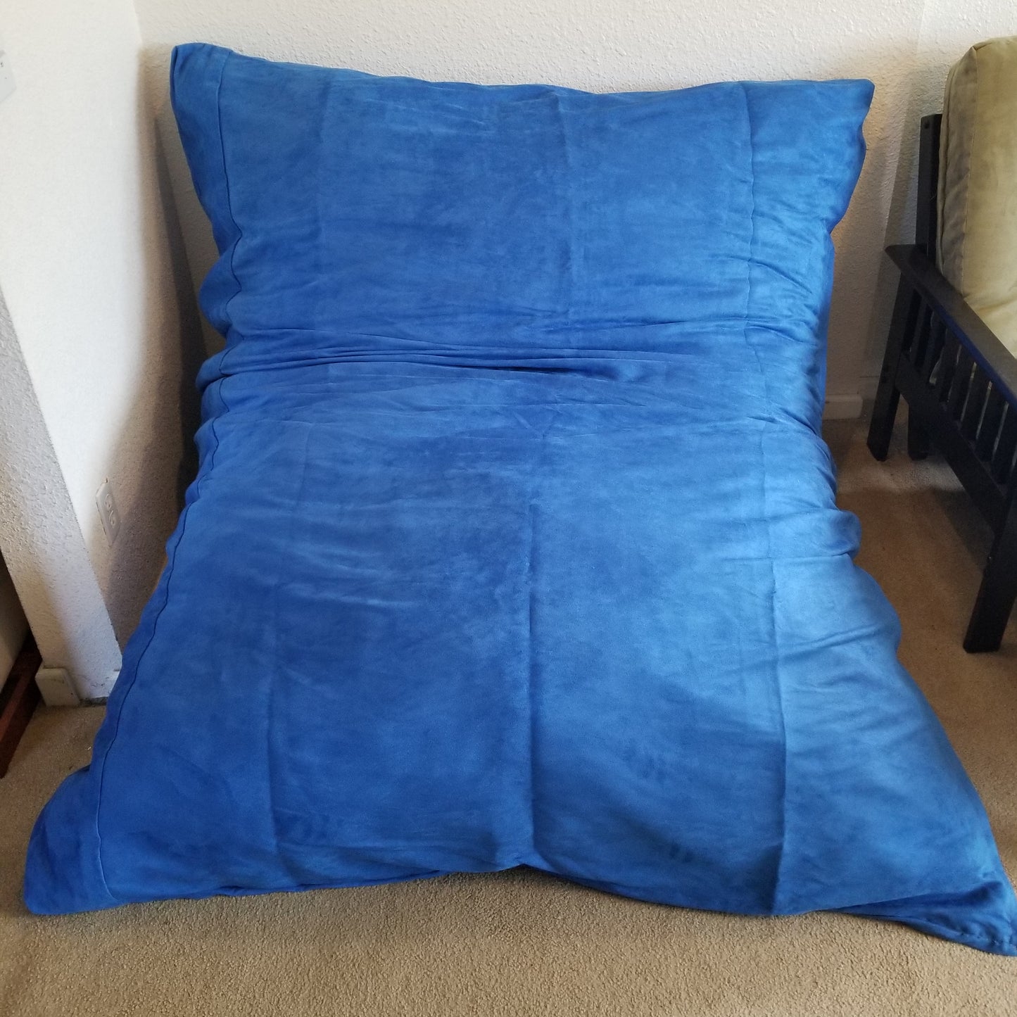 A Full Hug Bed & Crash Pad Shown With Cover Installed